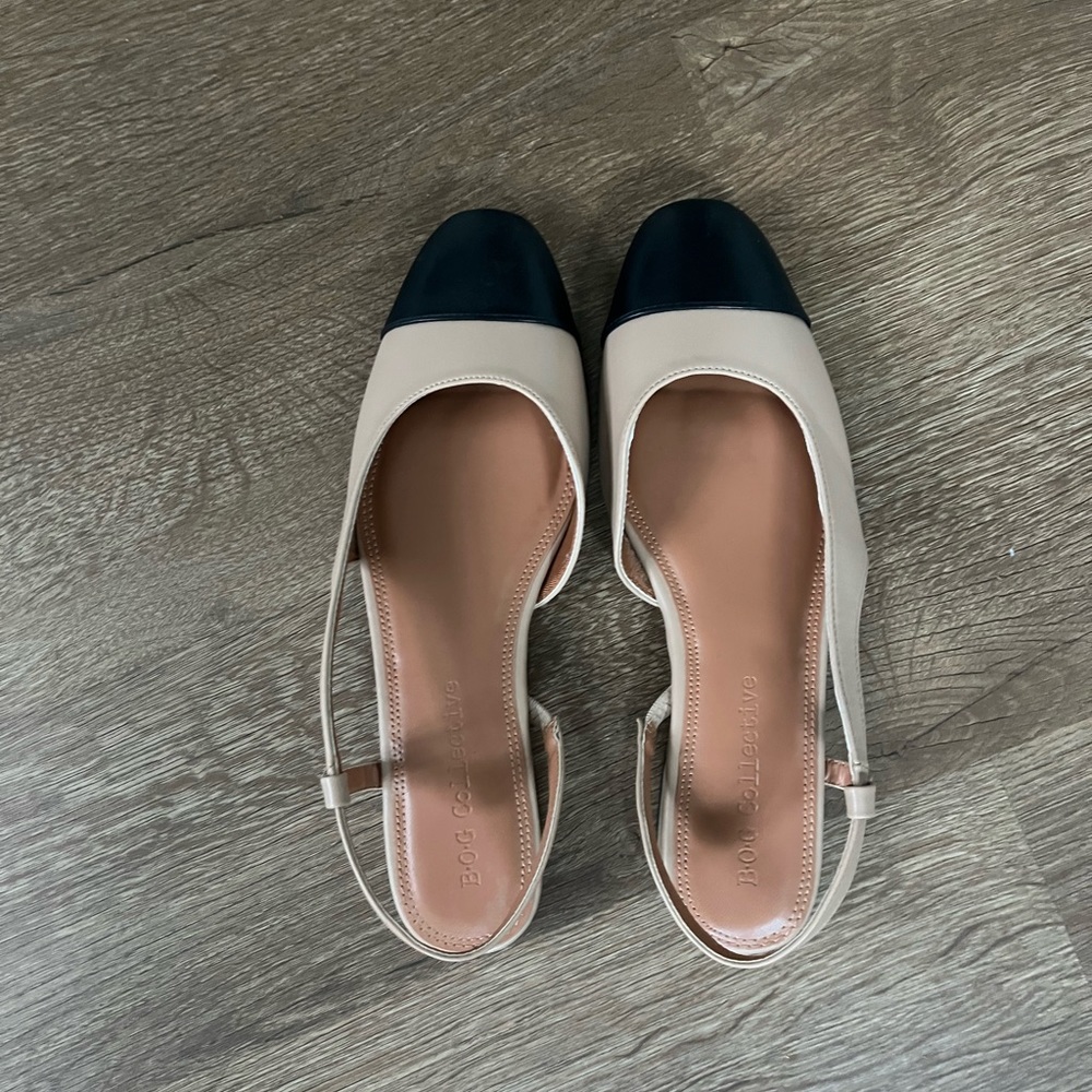 Two tone tan and black flats